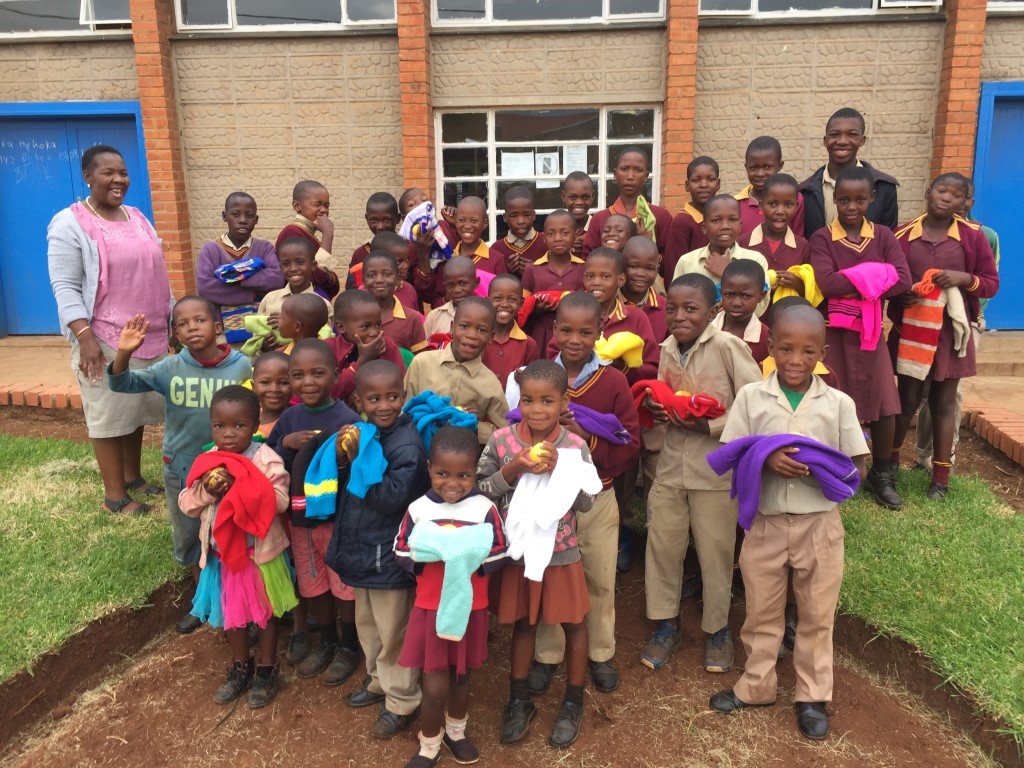 Help Lesotho. Children receive warm clothes
